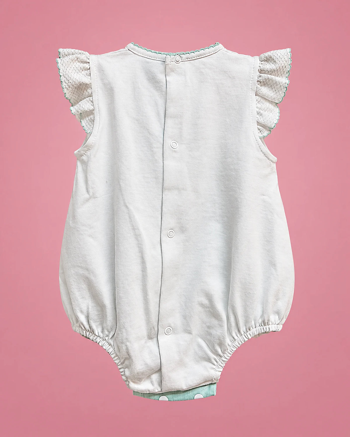 Sardon blanco y verde menta de lunares para bebé niña, vista de espalda | JR Baby Center