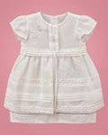 Vestido de bautizo blanco con doble falda y flores bordadas para bebé niña, vista de frente | JR Baby Center