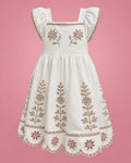 Vestido blanco con ramas bordadas beige y ruedo calado para niña, vista de frente | JR Baby Center
