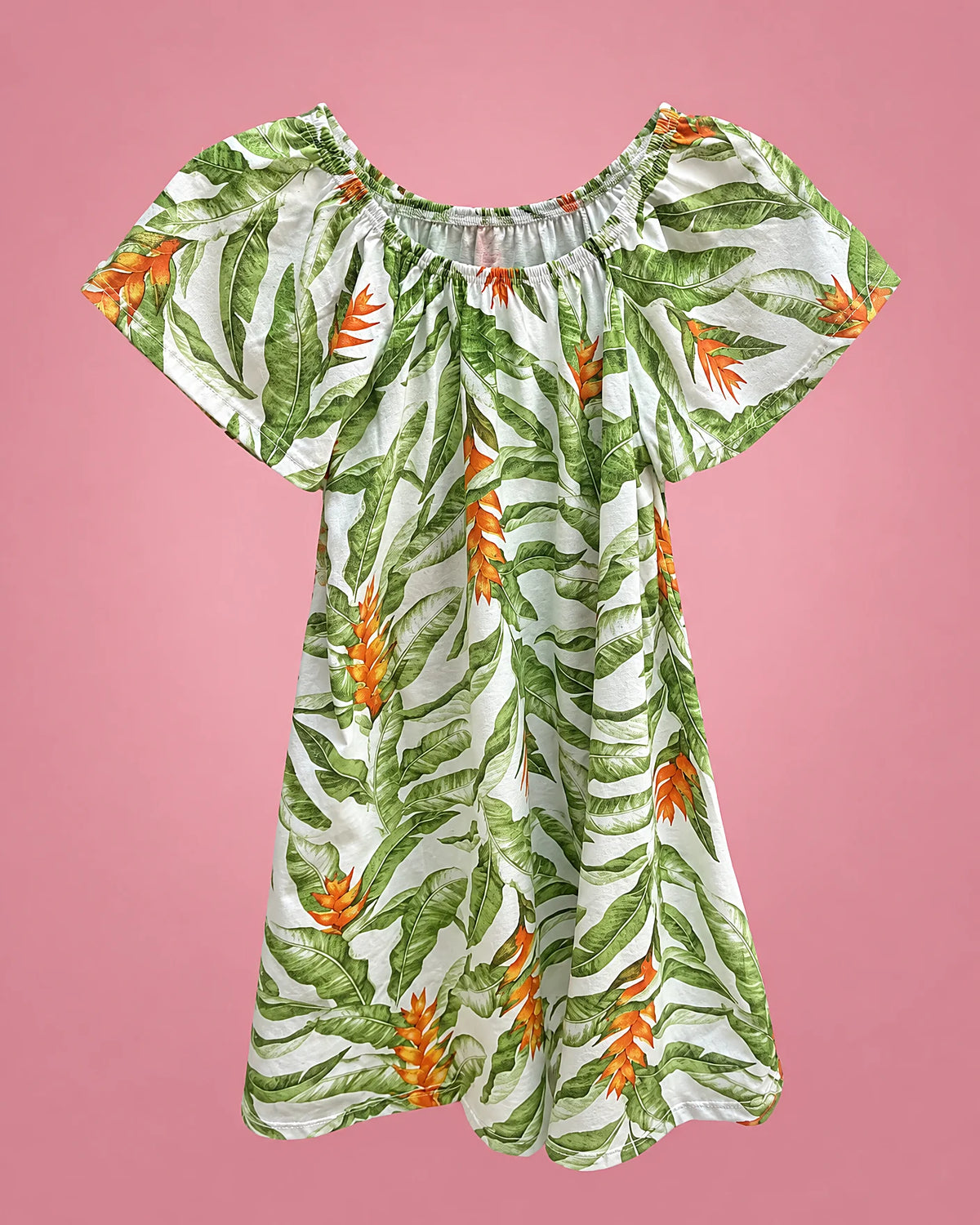 Vestido blanco con hojas tropicales y flores naranjas para niña, vista de frente | JR Baby Center