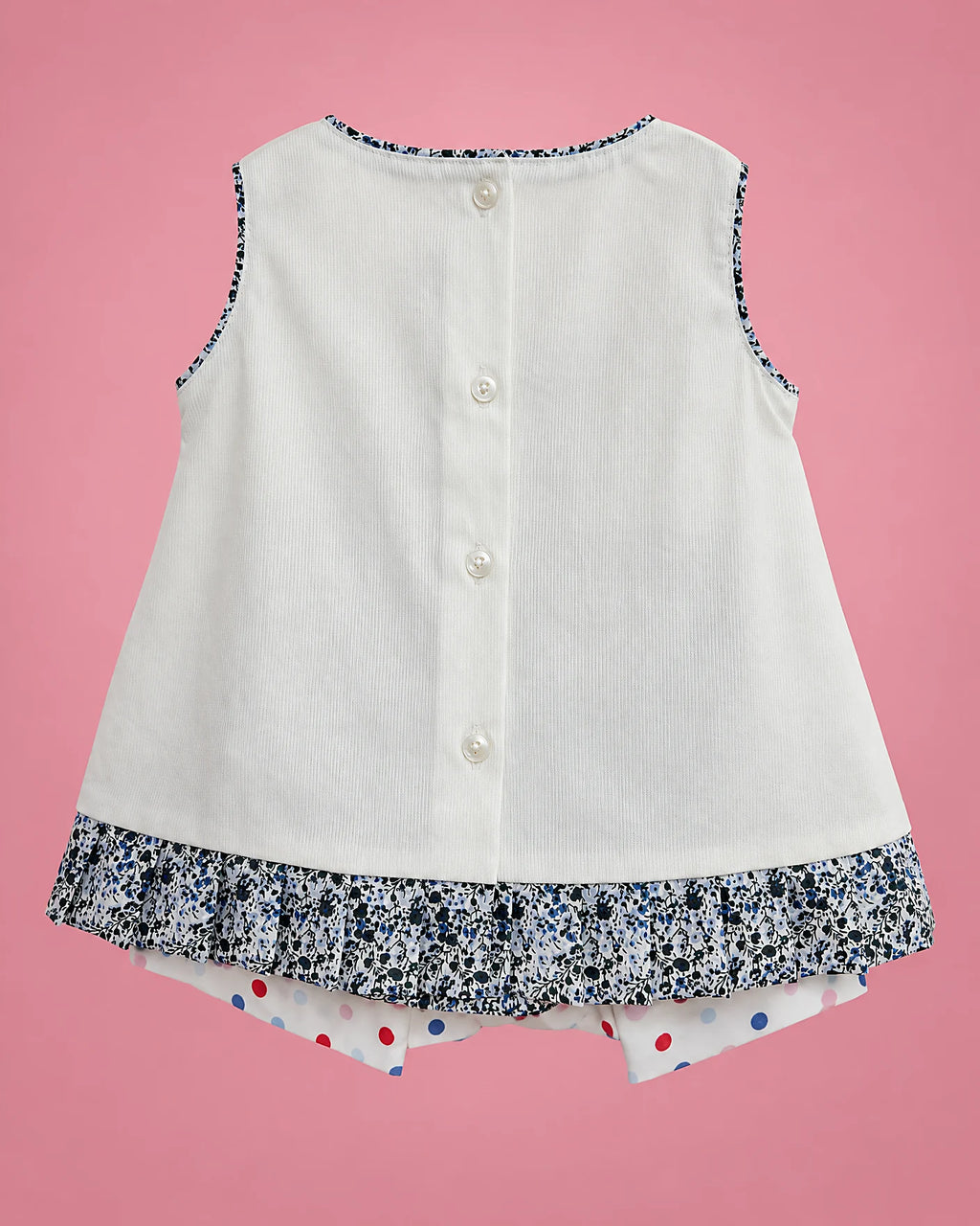 Vestido marfil con lazos y volante floral azul para bebé niña, vista de espalda | JR Baby Center
