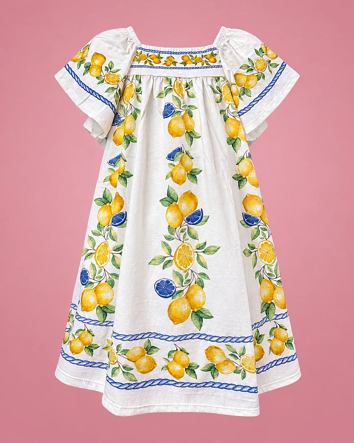 Vestido blanco de mangas mariposa con limones y ribete azul para niña, vista de frente | JR Baby Center