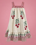 Vestido crema con cerezas rojas y volante de rayas para niña, vista de frente | JR Baby Center